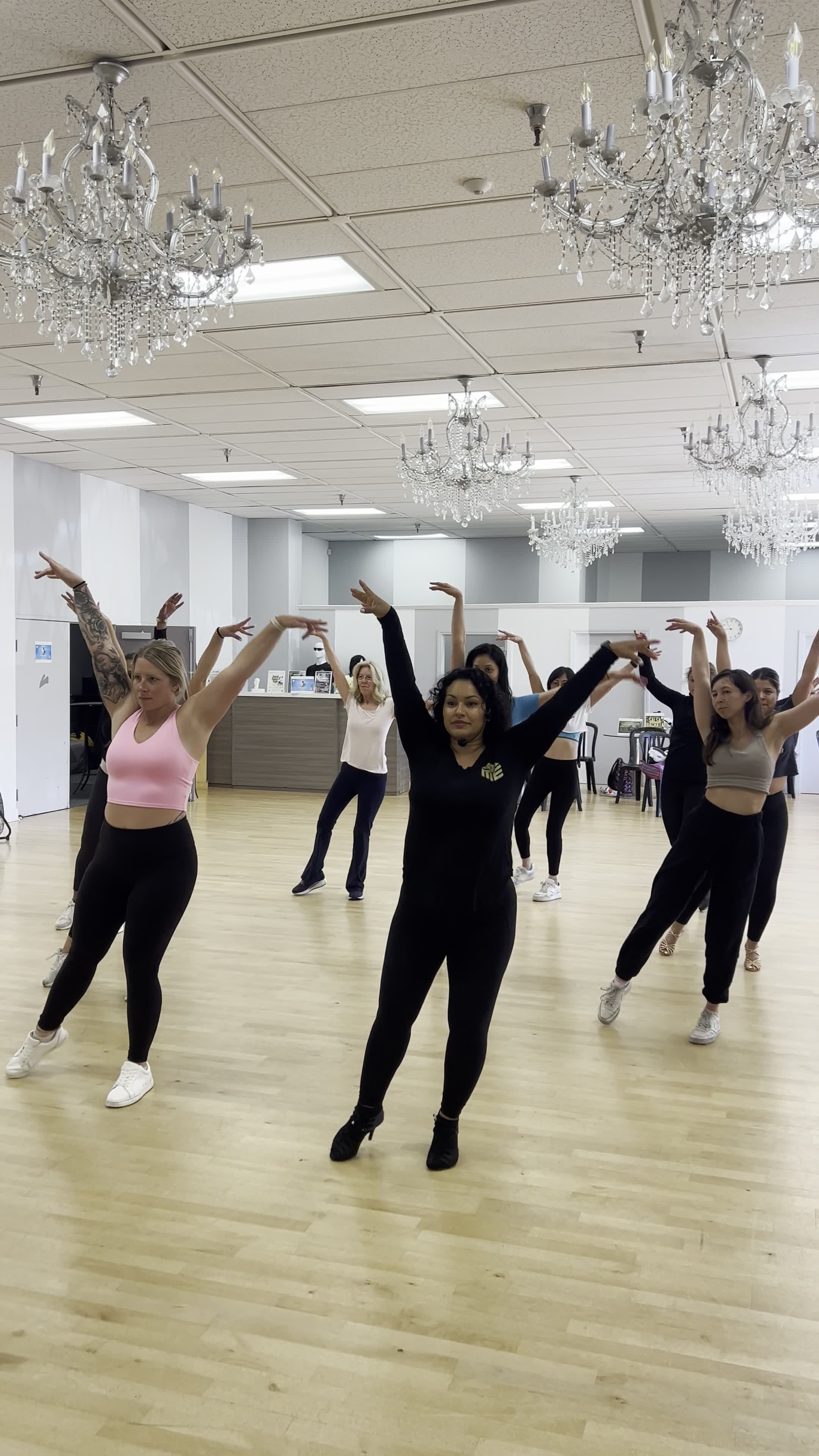 Dancers practicing arm styling together in a Ladies Styling class