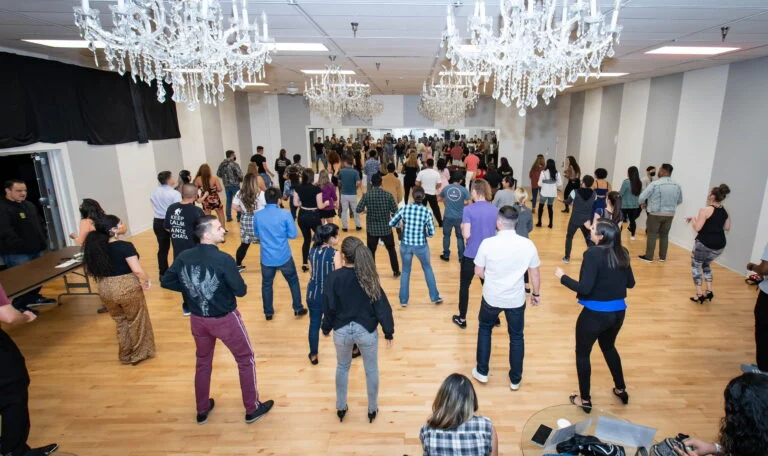 People enjoying salsa and bachata dancing in San Diego at Melómano classes